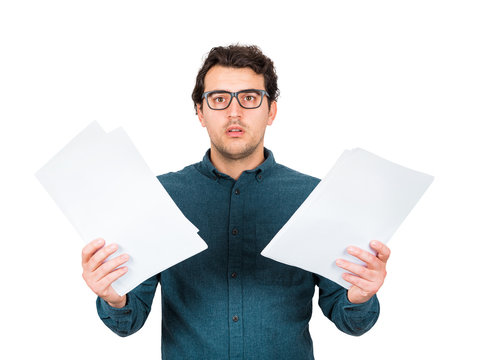 A man looking confused with documents in his hands